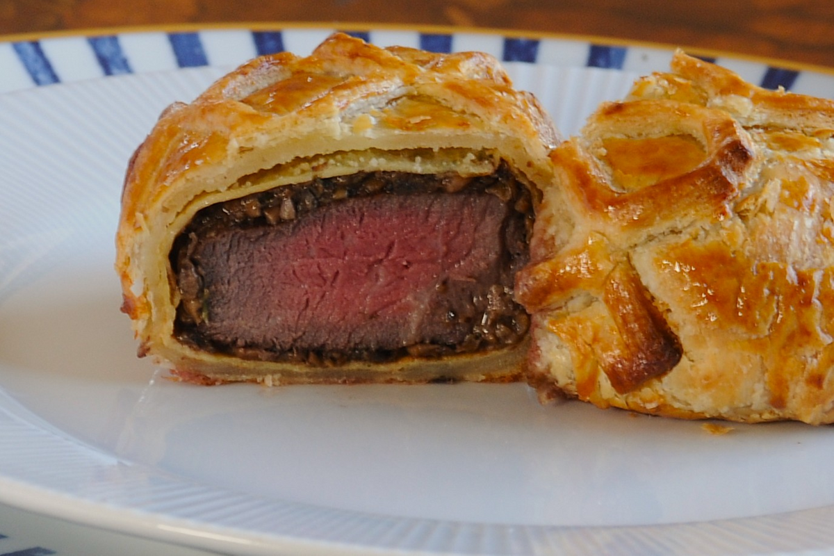 Close-up of beef Wellington layers — beef, mushroom duxelle and puff pastry, private chef Algarve